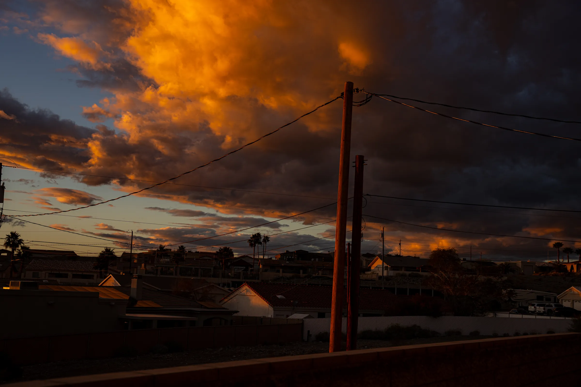 Fiery sunset clouds over the rooftops of Boulder City, Nevada