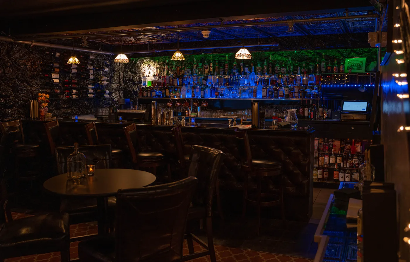 Moody bar interior lit in blue and amber